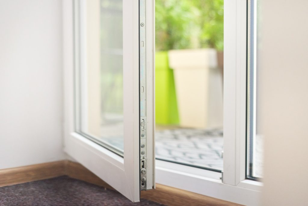 Open glass plastic white floor door to balcony terrace